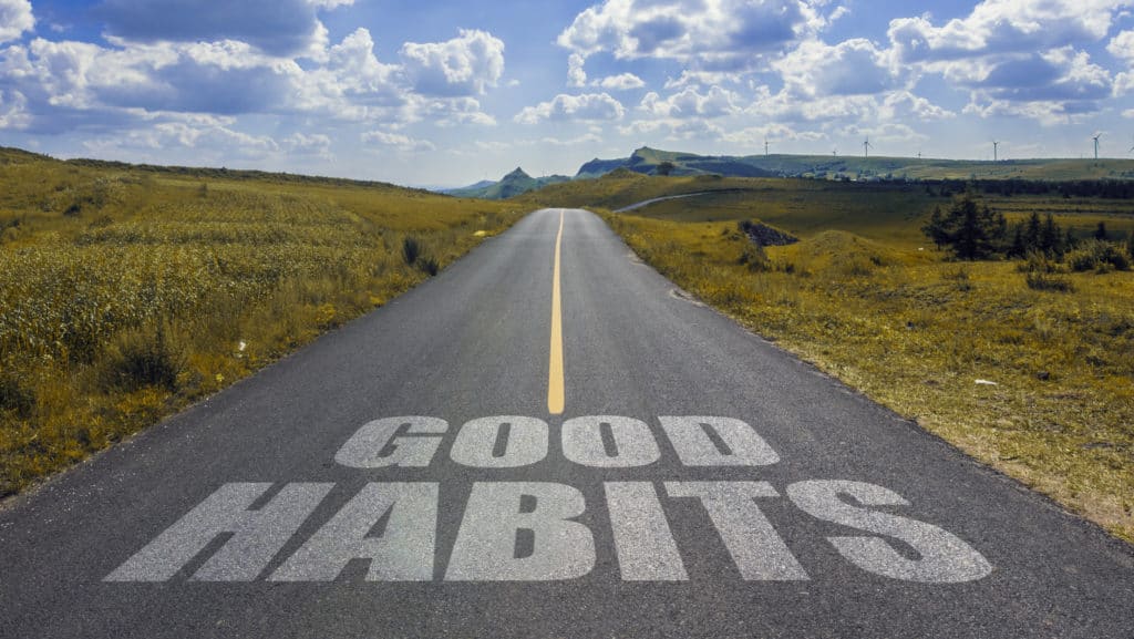 Road with "Good habits" painted on it